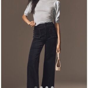 Anthropologie Maeve Navy Wide-Leg Corduroy Trousers with scallop pockets.